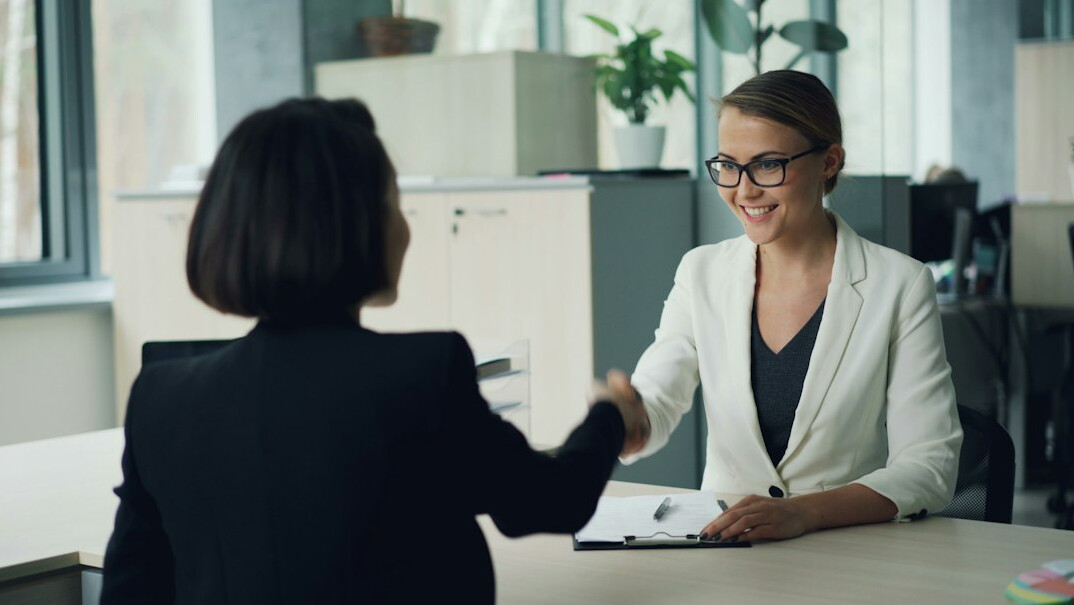 business handshake in meeting