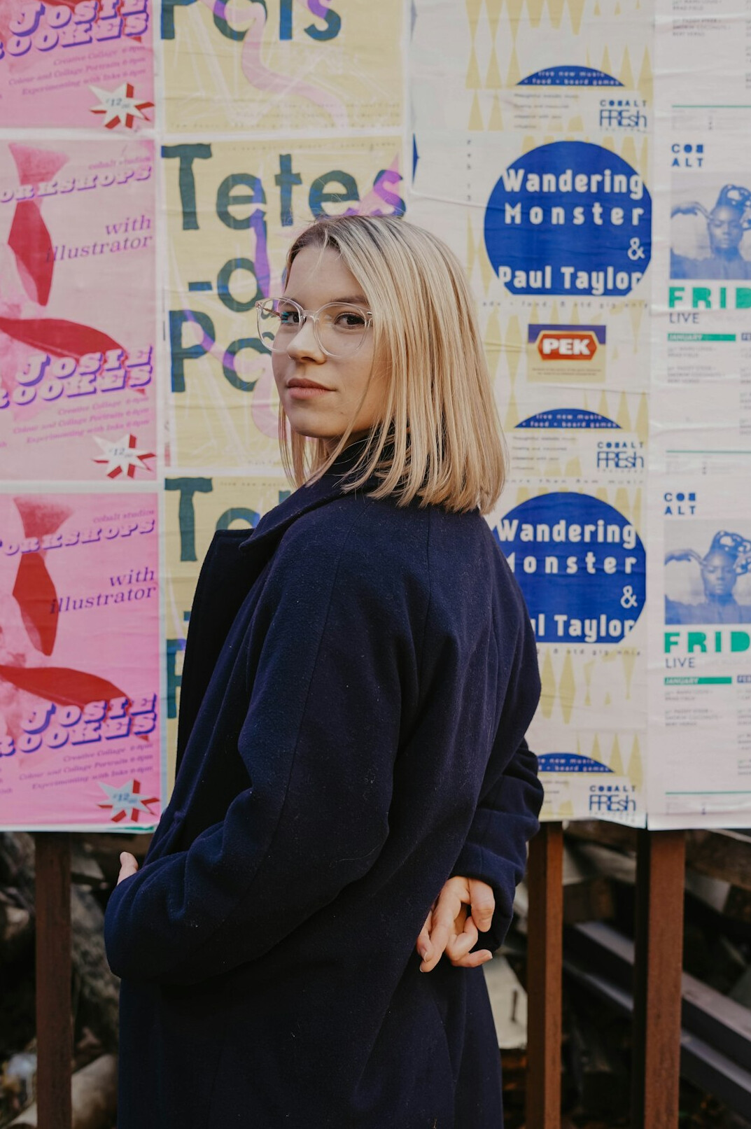 Portrait of a woman with short blond hair in a navy jacket